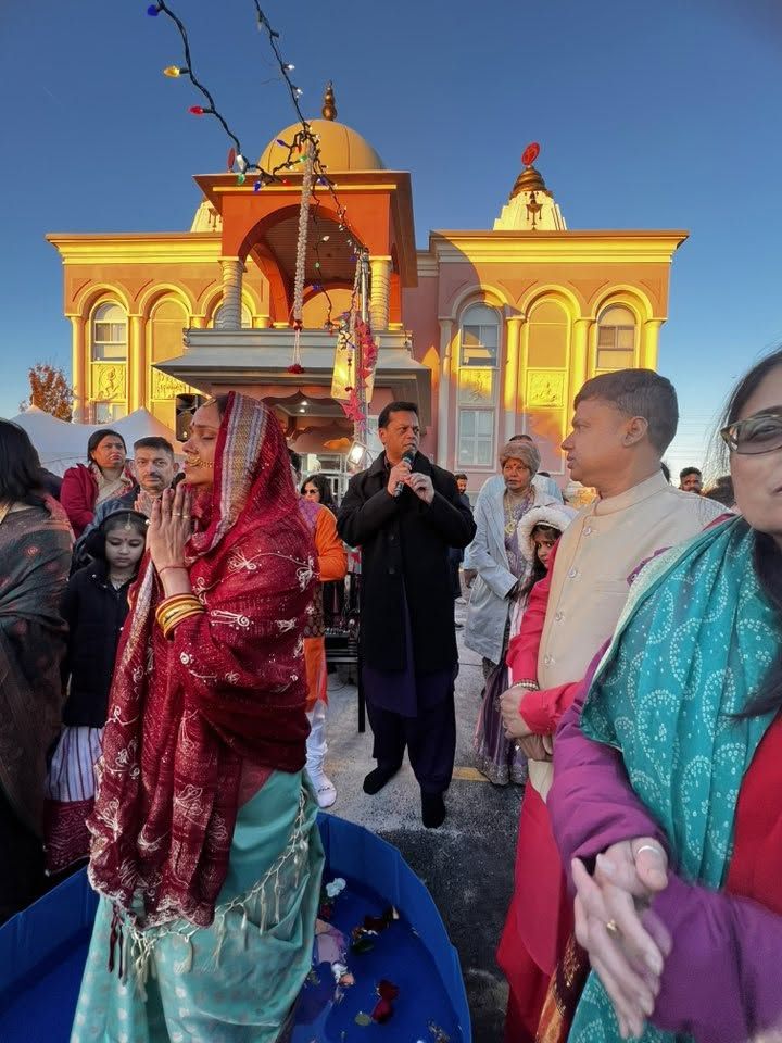 Families at the ghat in festive clothes