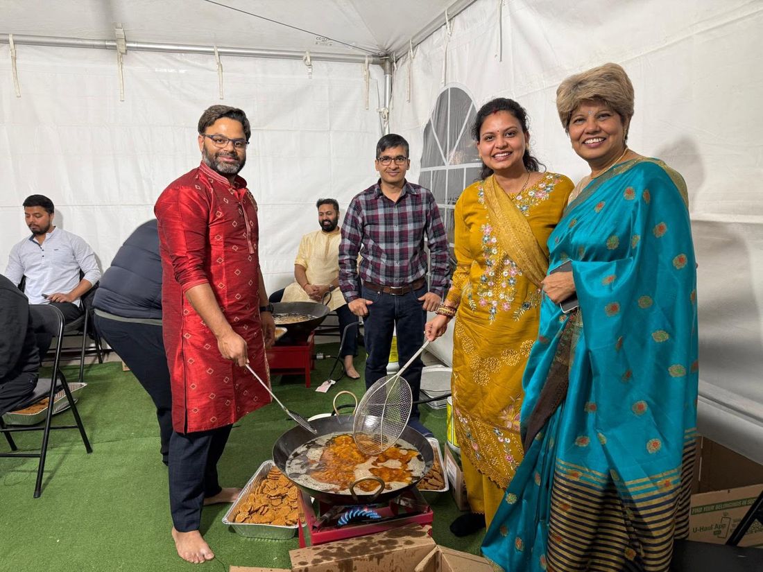 Volunteers frying Thekua in the BAJCCA tent